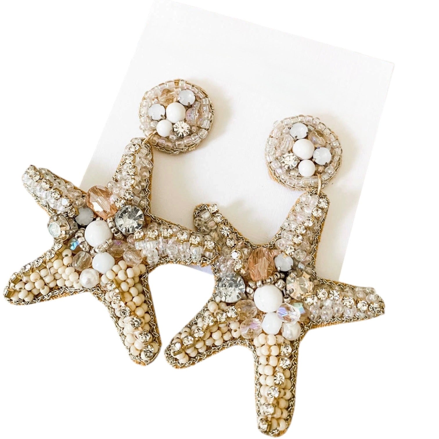 Starfish-shaped earrings with bead and crystal details on a white background