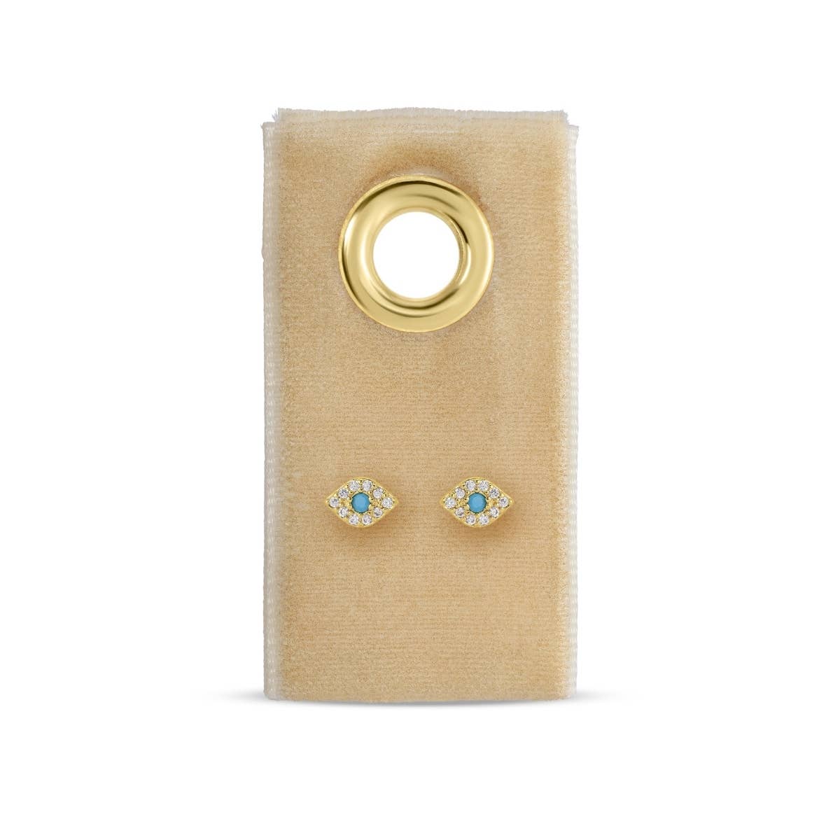 Pair of gold earrings with turquoise stones on a beige card with a gold ring.