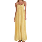 Yellow maxi dress worn by a person on a white background