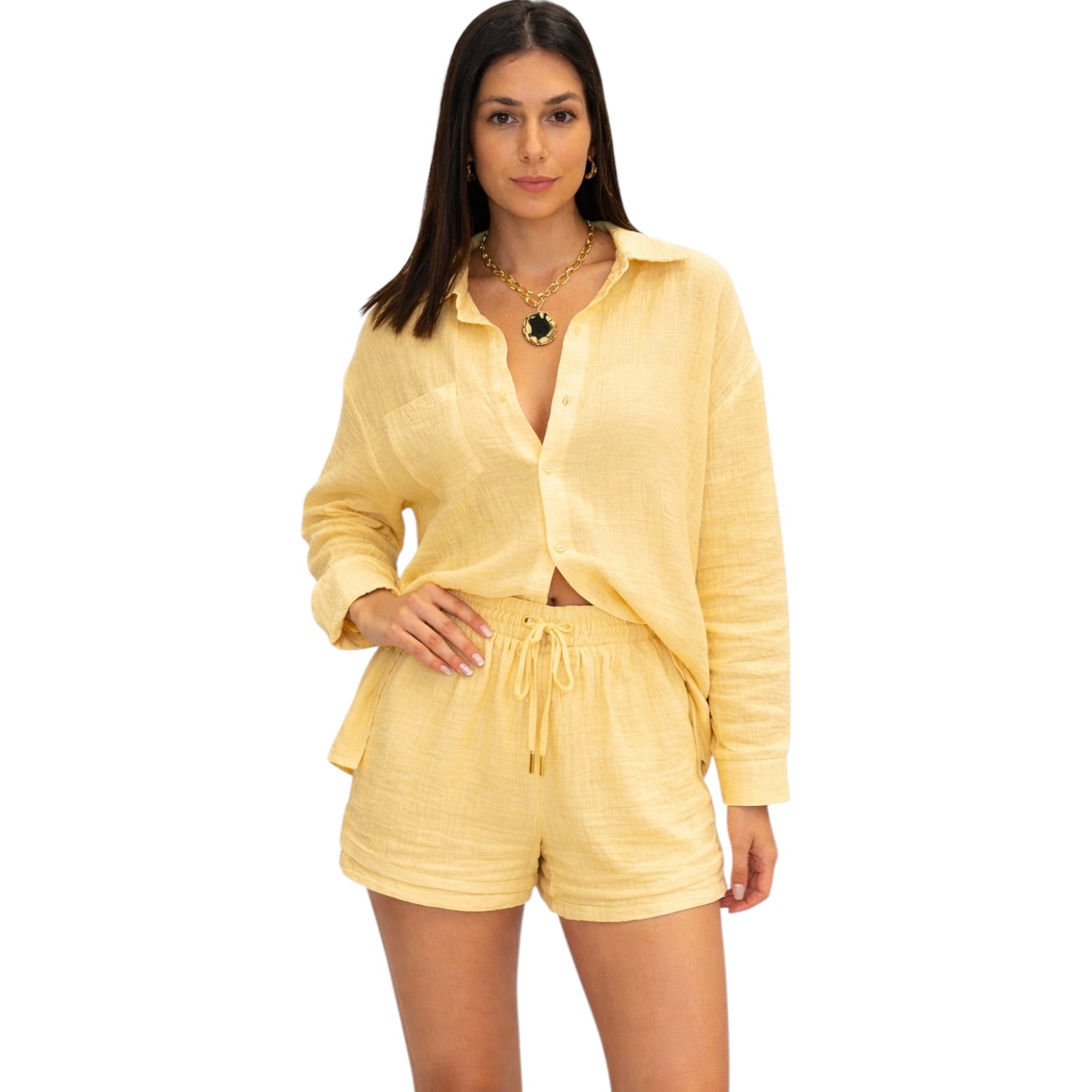 Woman wearing a yellow outfit on a white background