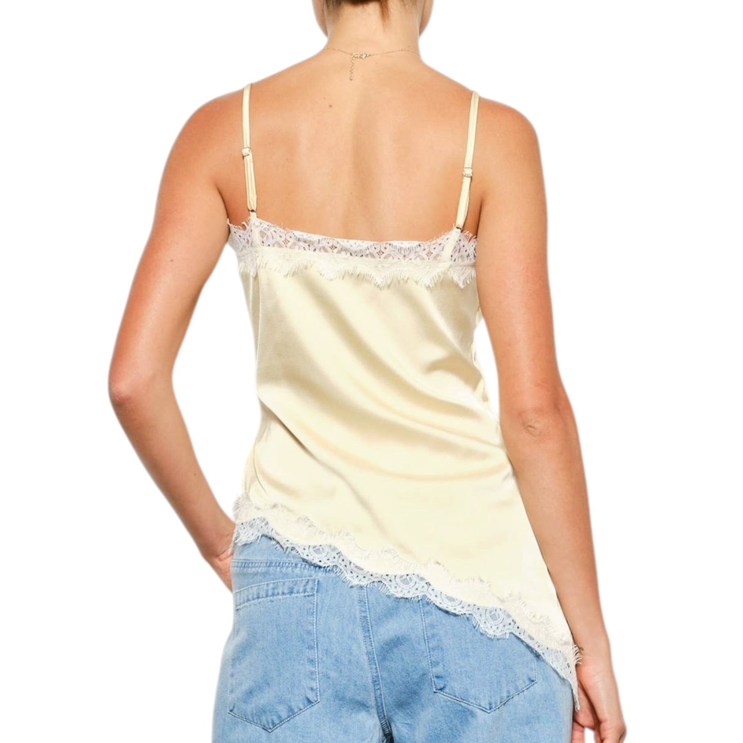 woman wearing yellow satin cami with white lace on white background
