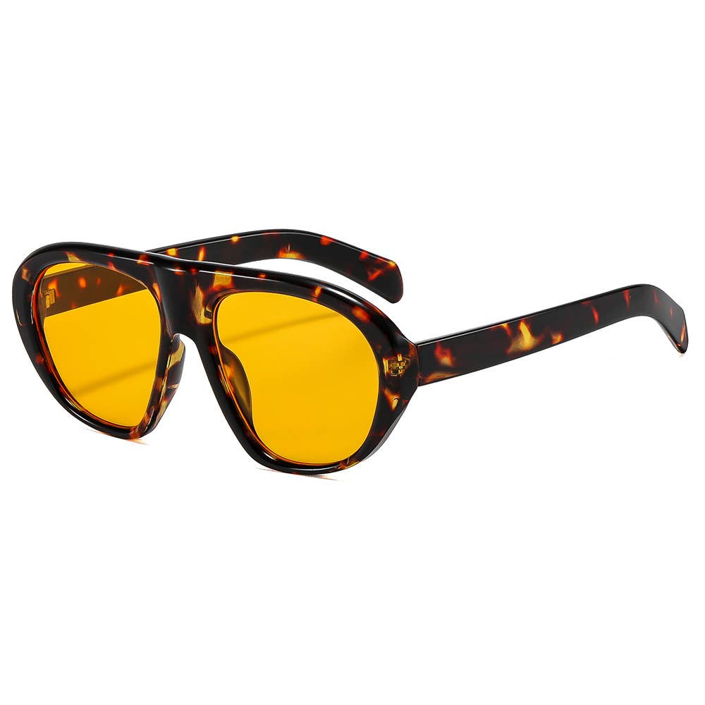 Sunglasses with tortoiseshell frame and orange lenses on a white background