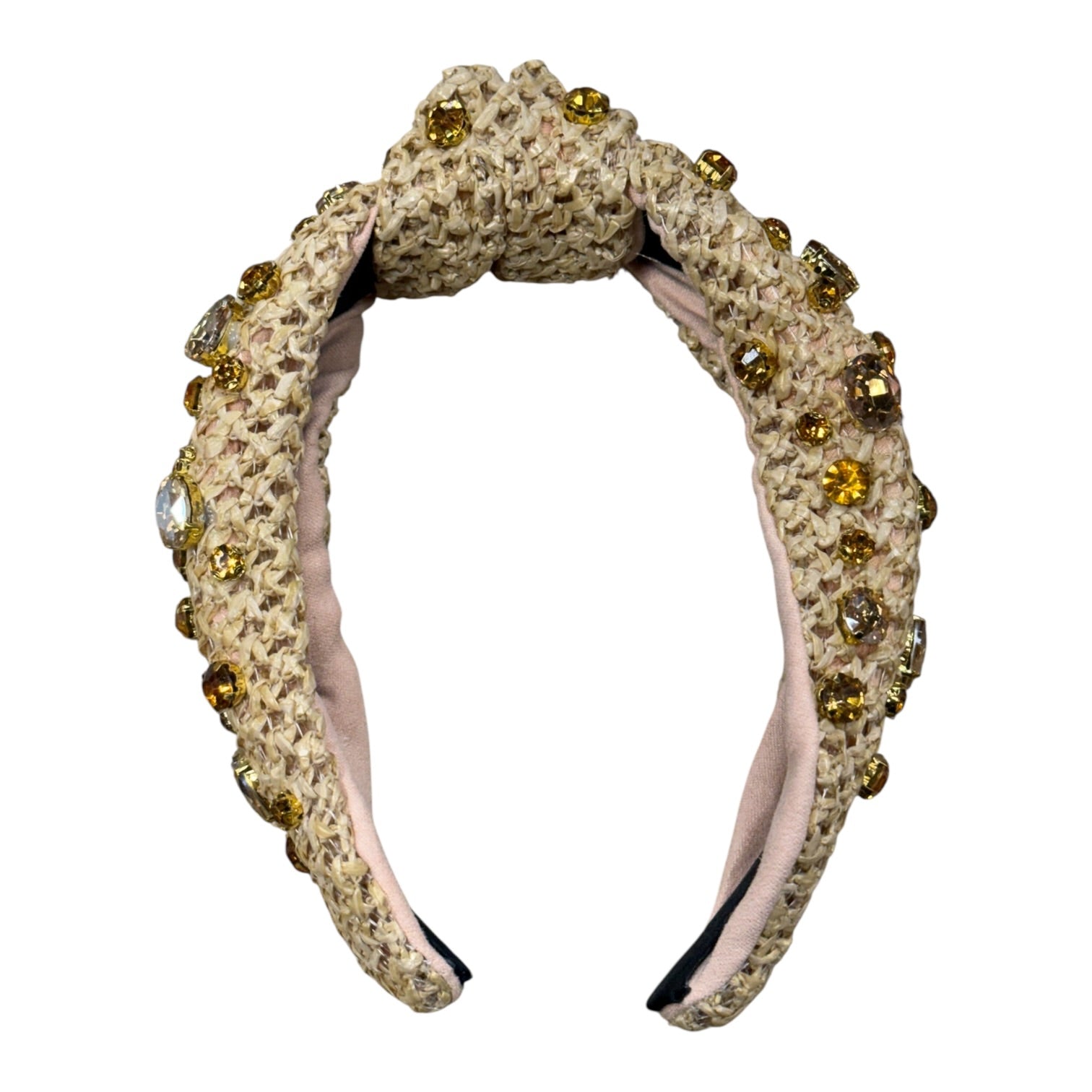 Decorative headband with beige textured band and gold embellishments on a white background
