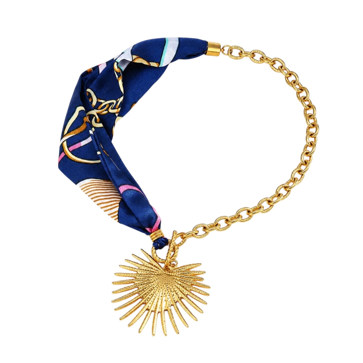 Necklace with a blue patterned fabric wrap and gold chain and heart sunburst charm on a white background