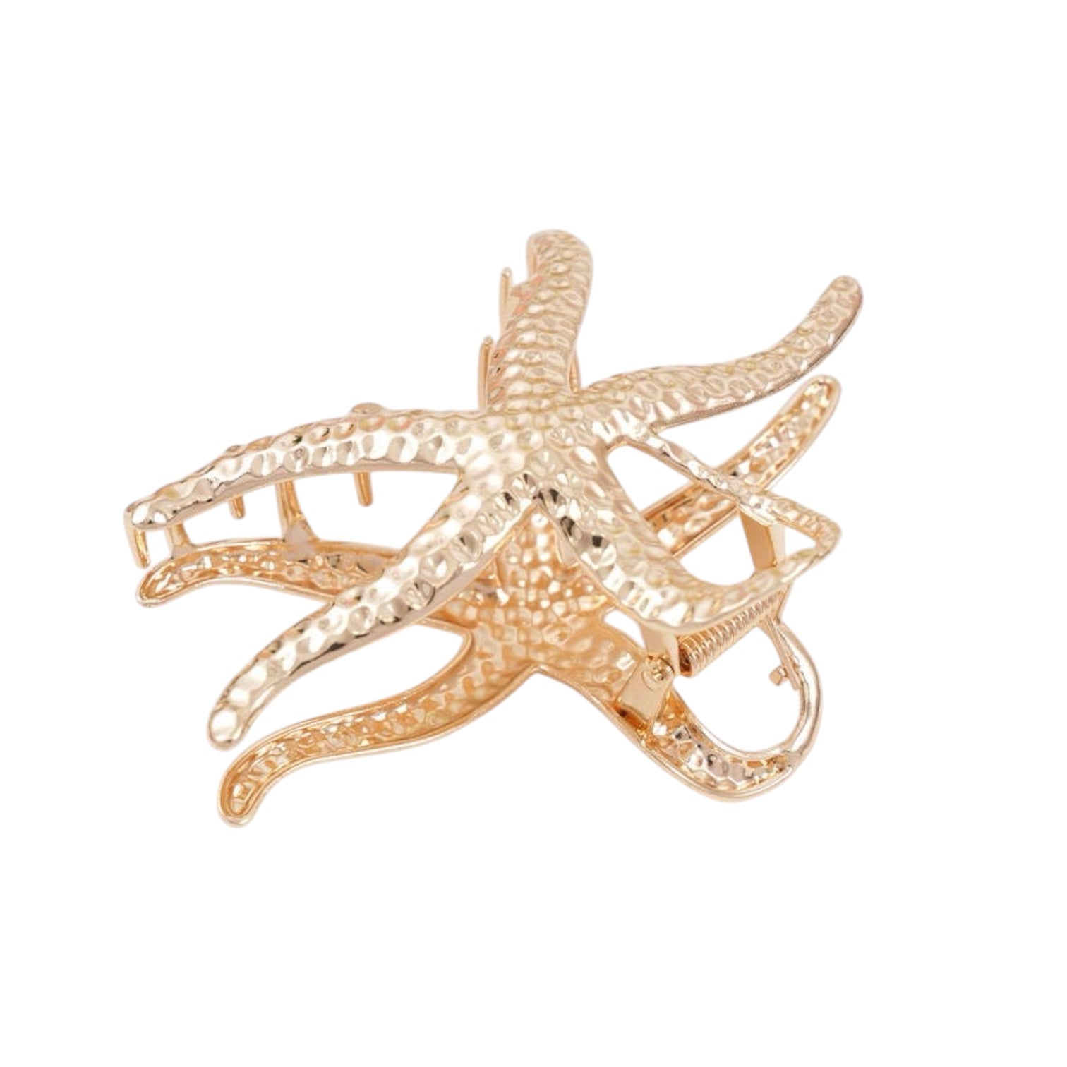Gold starfish-shaped claw clip on a white background