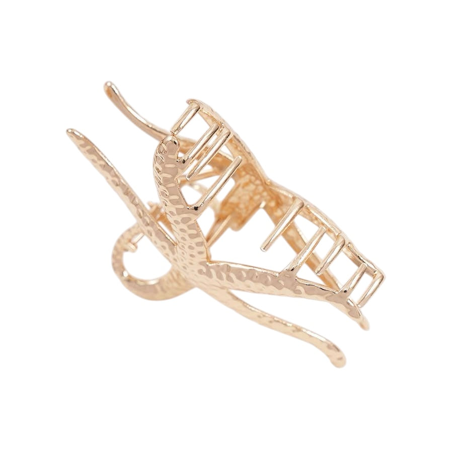 Gold-colored clip on a white background