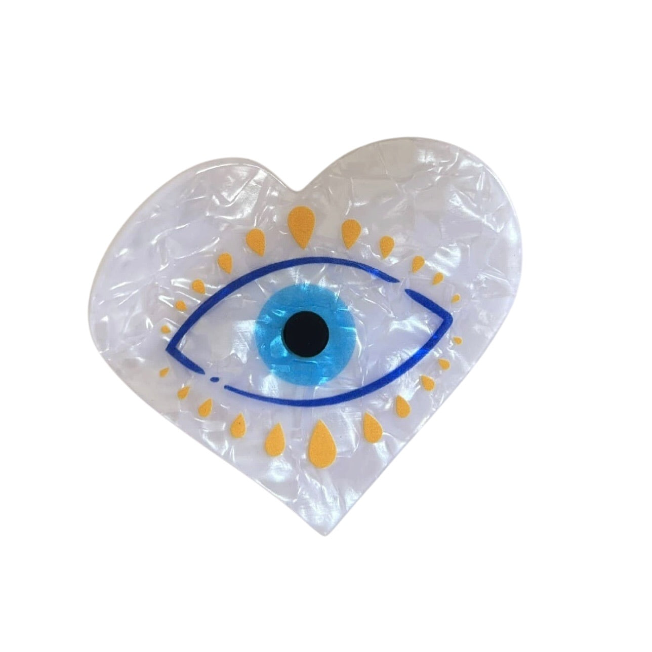 Heart-shaped claw clip with an eye design on a white background