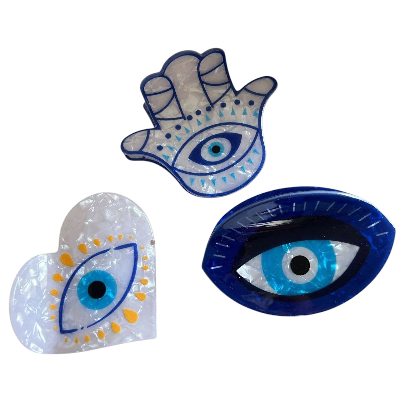 Eye-shaped claw clip on a white background