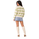 A woman shown from the back wearing a cream and light green striped fuzzy knit sweater, a denim mini skirt, and cream knee-high heeled boots against a plain white background.