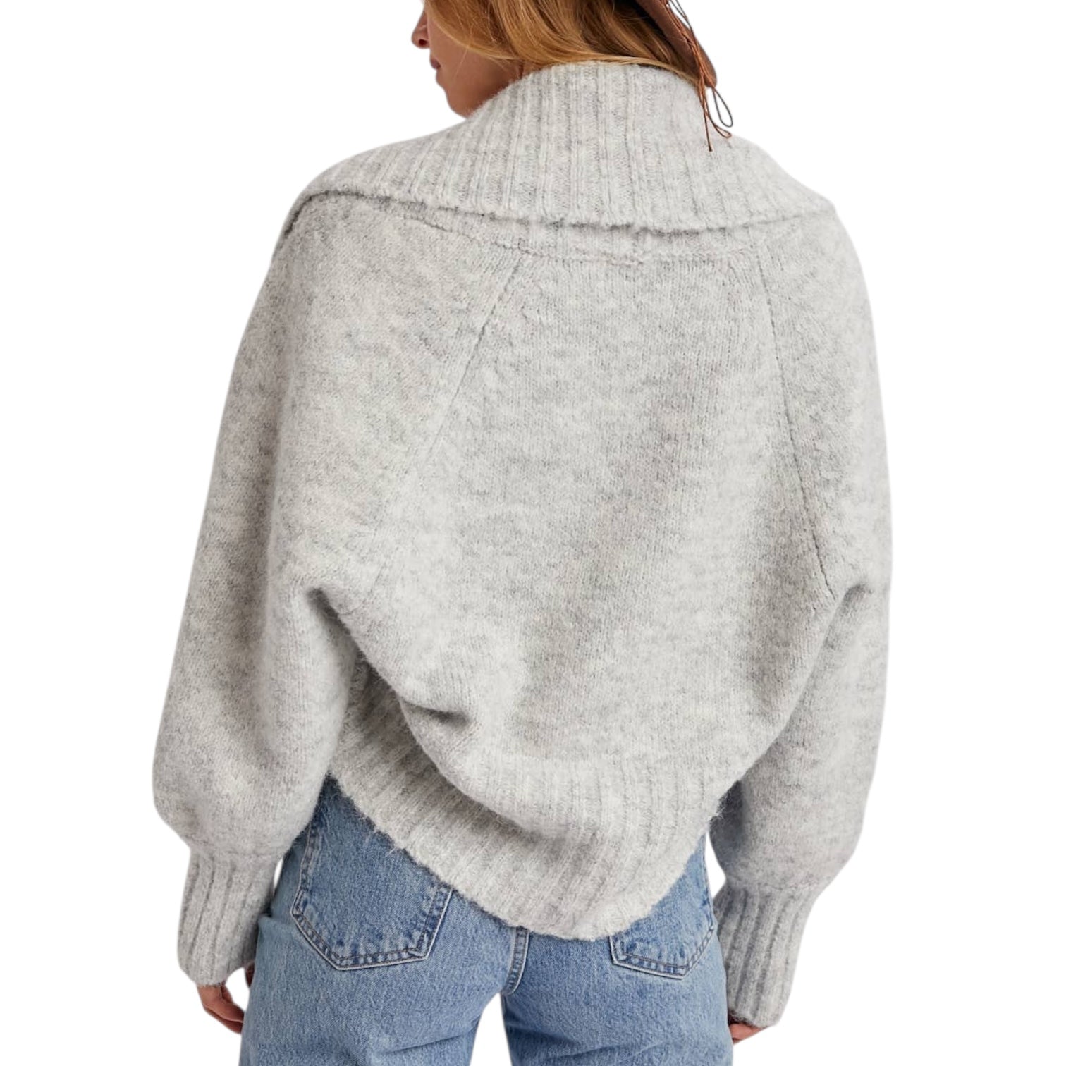 Light gray sweater worn by a person on a white background