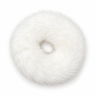 A white faux fur donut-shaped hair accessory photographed from directly above on a clean white background.