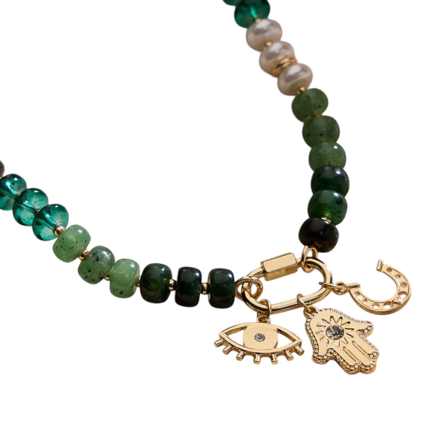 Beaded bracelet with eye and hamsa hand charms on a white background