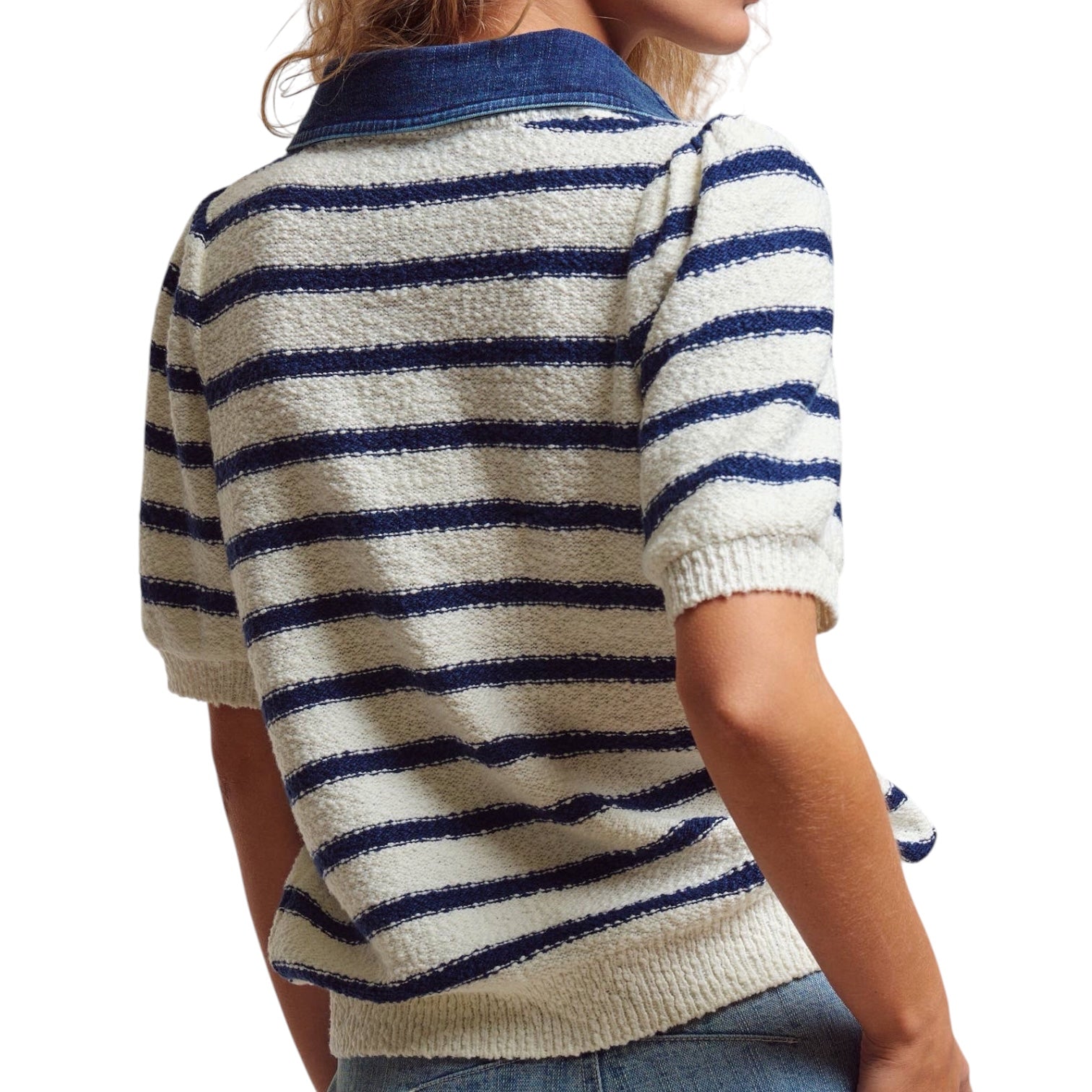 Person wearing a white and blue striped sweater on a white background