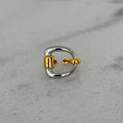 gold & silver ring on grey surface