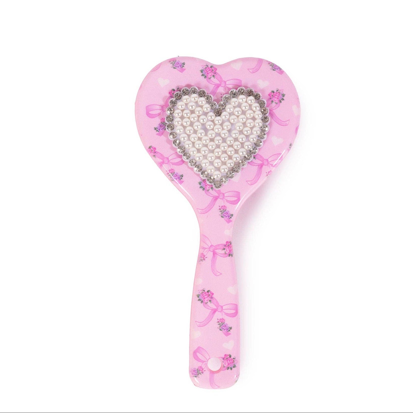 Pink heart-shaped brush with pearl center on a white background