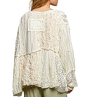 Lace blouse with floral patterns on a white background