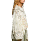 Woman wearing a floral lace dress on a white background