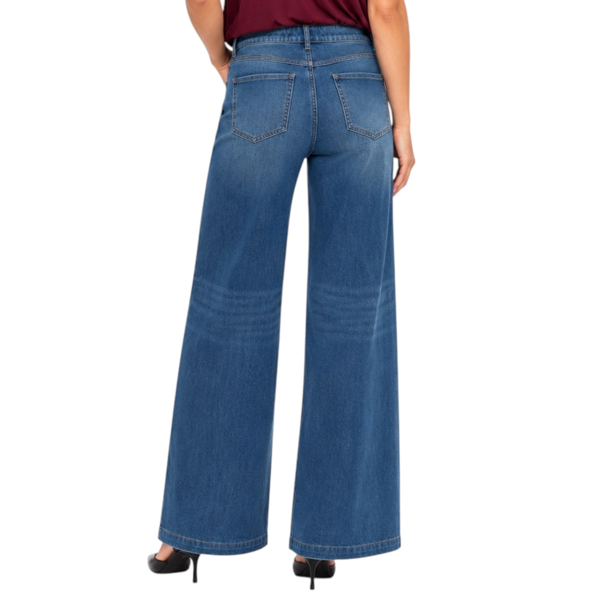 A person shown from the back wearing blue wide-leg denim jeans with a maroon top and black high heels against a plain white background.