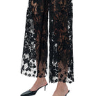 Black lace pants on a white background