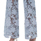 Light blue lace pants on a white background