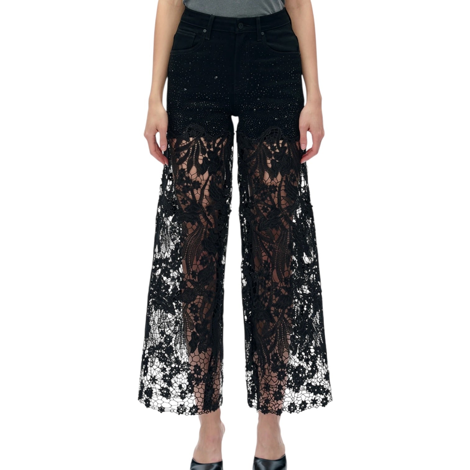 Black lace pants worn by a person on a white background