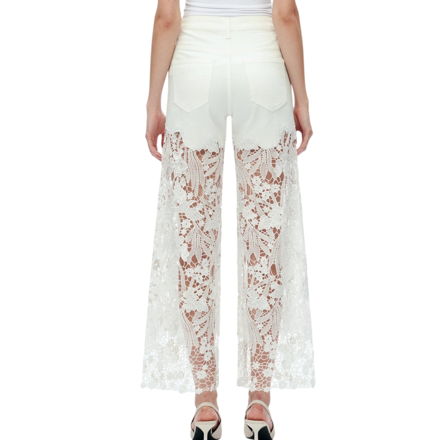 White lace pants worn by a person on a white background