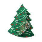 A Christmas tree-shaped green enamel pin with white line details, red, green, and blue polka dots, and a clear rhinestone accent on a white background.