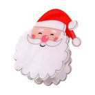 A festive Santa Claus face accessory with a red hat, white beard, pink cheeks and nose, outlined in black, shown on a plain white background.