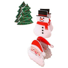 Three Christmas-themed paper clip decorations on a plain white background: a green tree with red dots, a snowman in a black top hat with a red scarf, and a Santa Claus face with red hat and white beard.