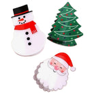 Three Christmas-themed paper cutout decorations on a white background: a snowman with a black hat and red scarf, a green Christmas tree with colorful ornaments, and a Santa Claus face with a red hat and white beard.
