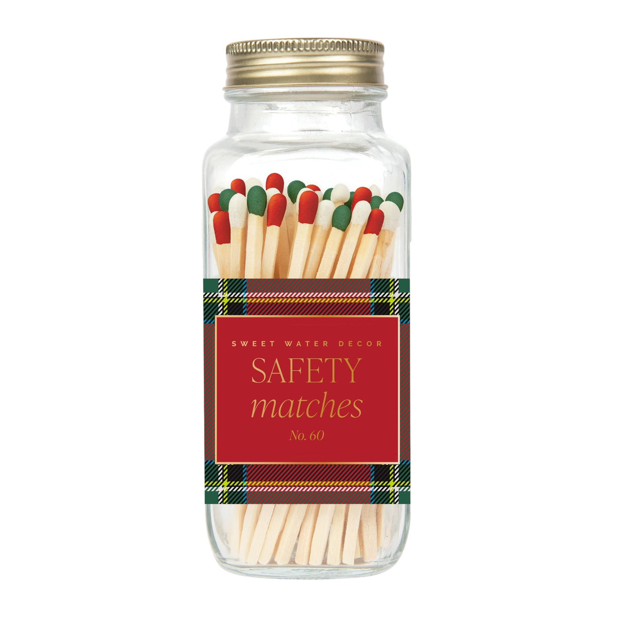 A clear glass jar filled with safety matches, sealed with a gold metal lid and wrapped in a red label that reads 'SAFETY matches No. 60' with green plaid trim.
