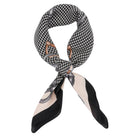 Black and white patterned scarf with decorative elements on a white background