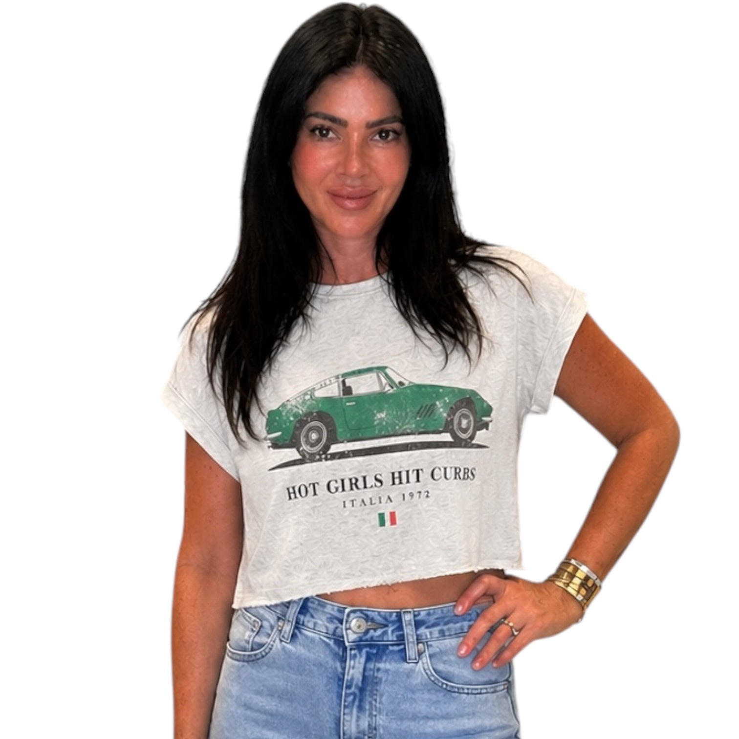 Woman wearing a t-shirt with a graphic design and text.