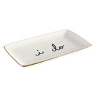 White rectangular dish with 'i do' text on a white background
