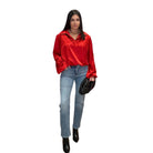 model wearing red satin balloon sleeve blouse
