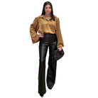 model wearing camel satin blouse