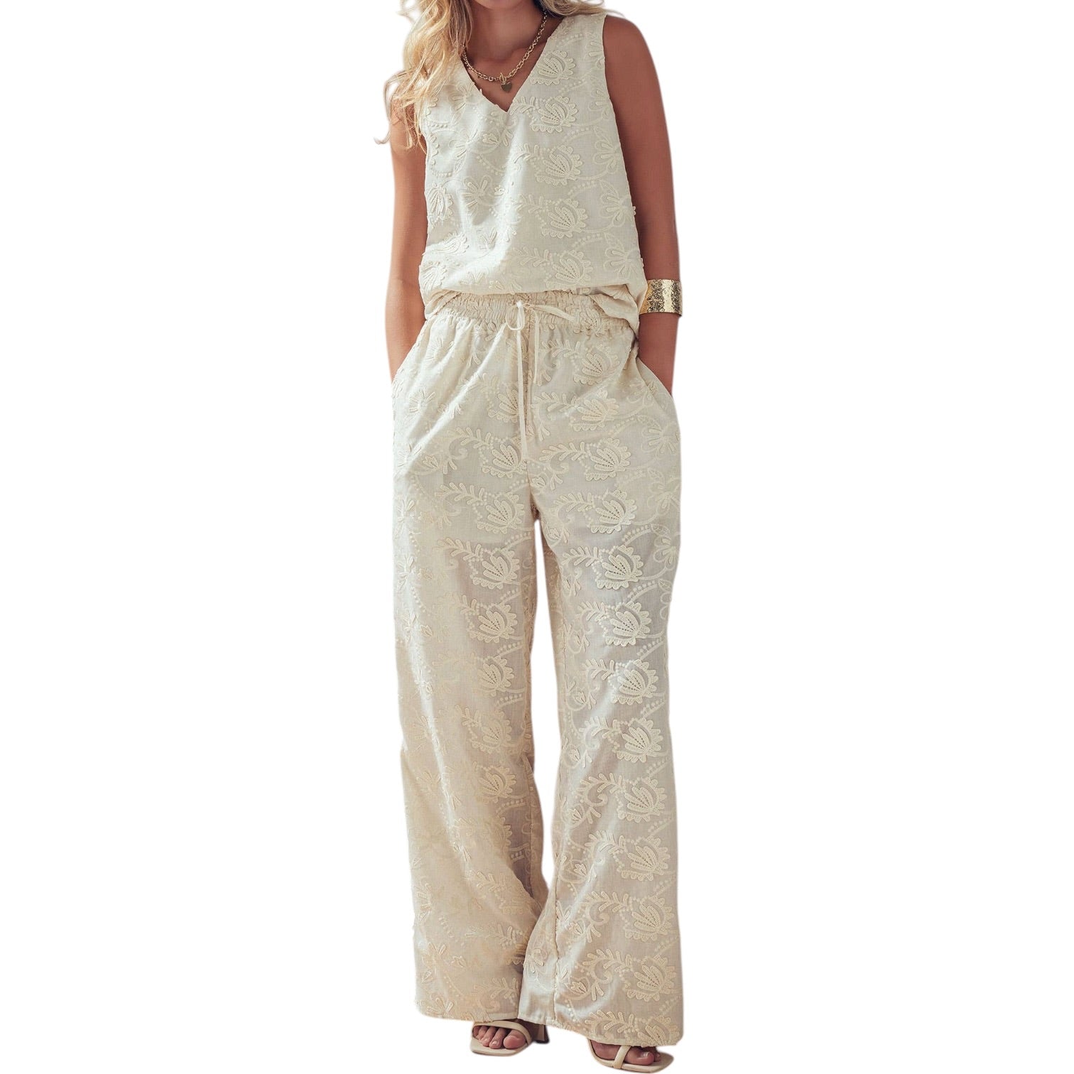 Beige jumpsuit worn by a model on a white background