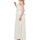 cream ruffle dress on white background