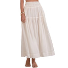 Beige checkered skirt worn by a person on a white background