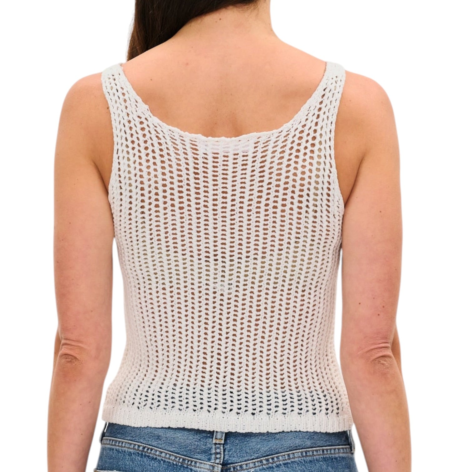 Person wearing a white knit tank top on a white background