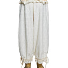 White lace pants with gold accents on a white background