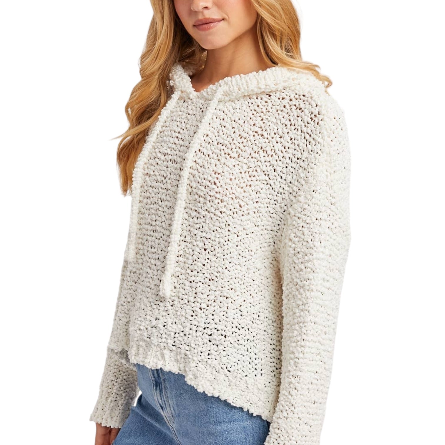 Woman wearing a textured white sweater on a white background