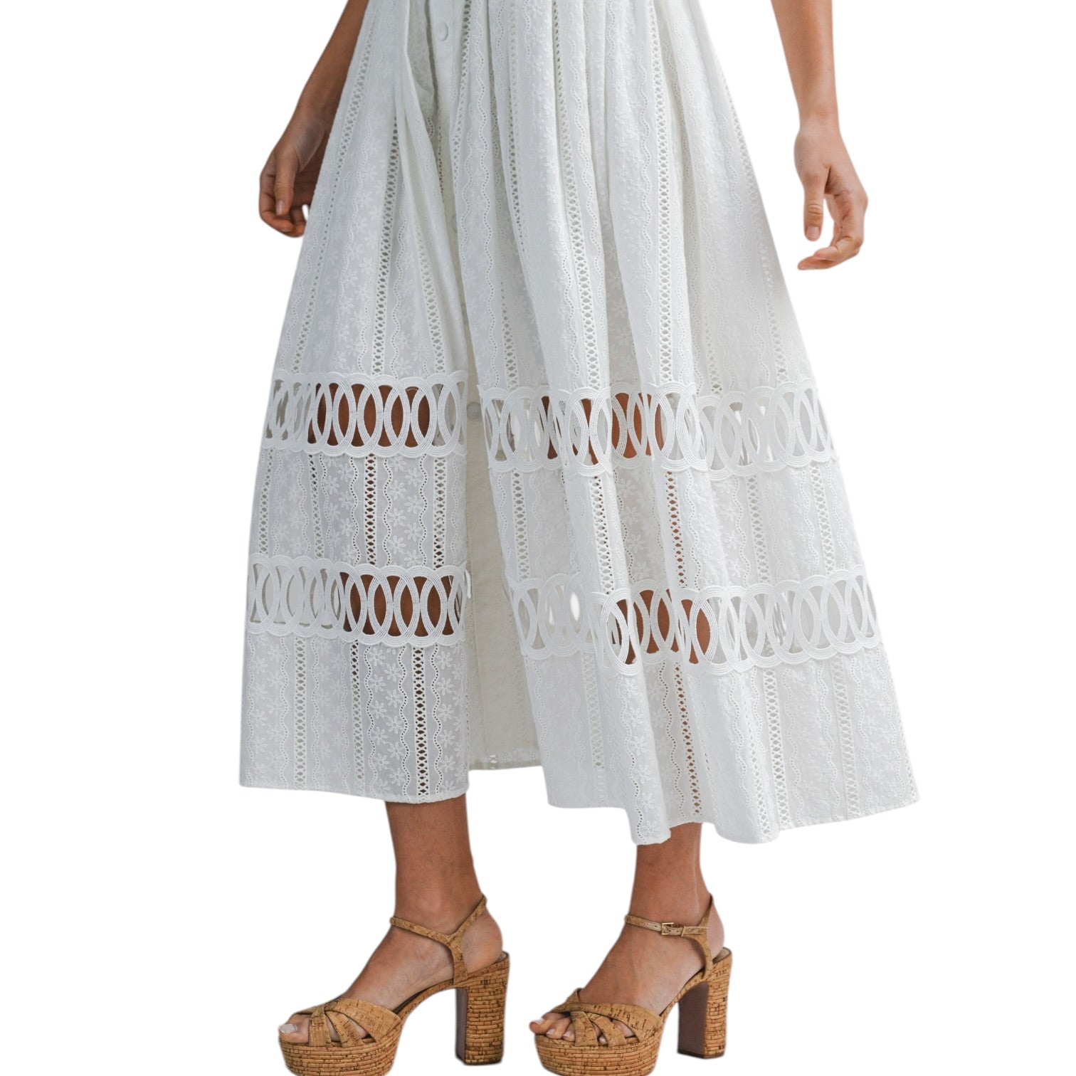White lace dress with cut-out patterns on a white background