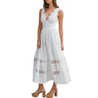 White lace dress worn by a model on a white background