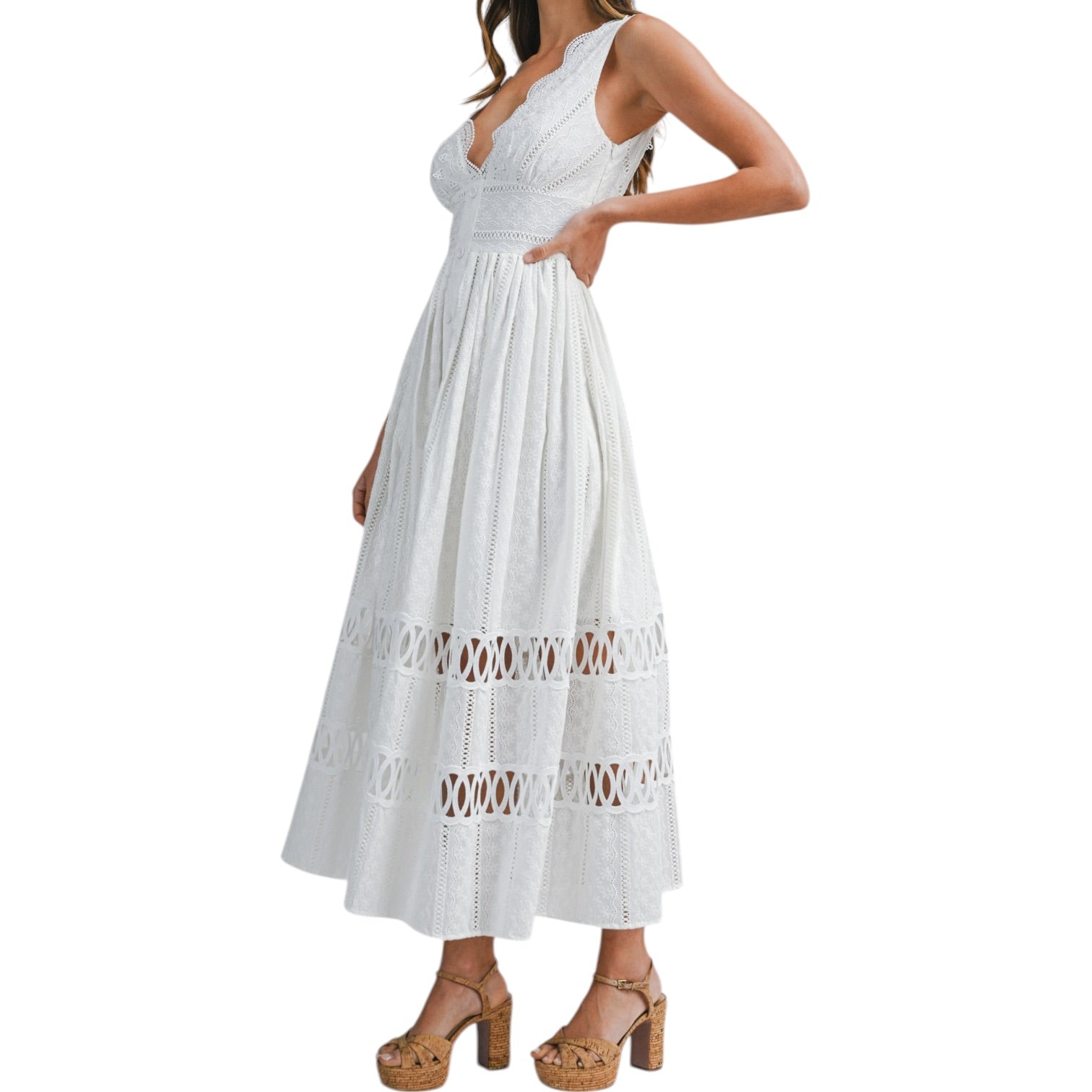 White lace dress worn by a model on a white background