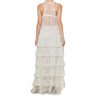 Cream lace dress with tiered layers on a white background