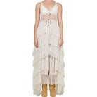Cream lace dress with tiered layers on a white background