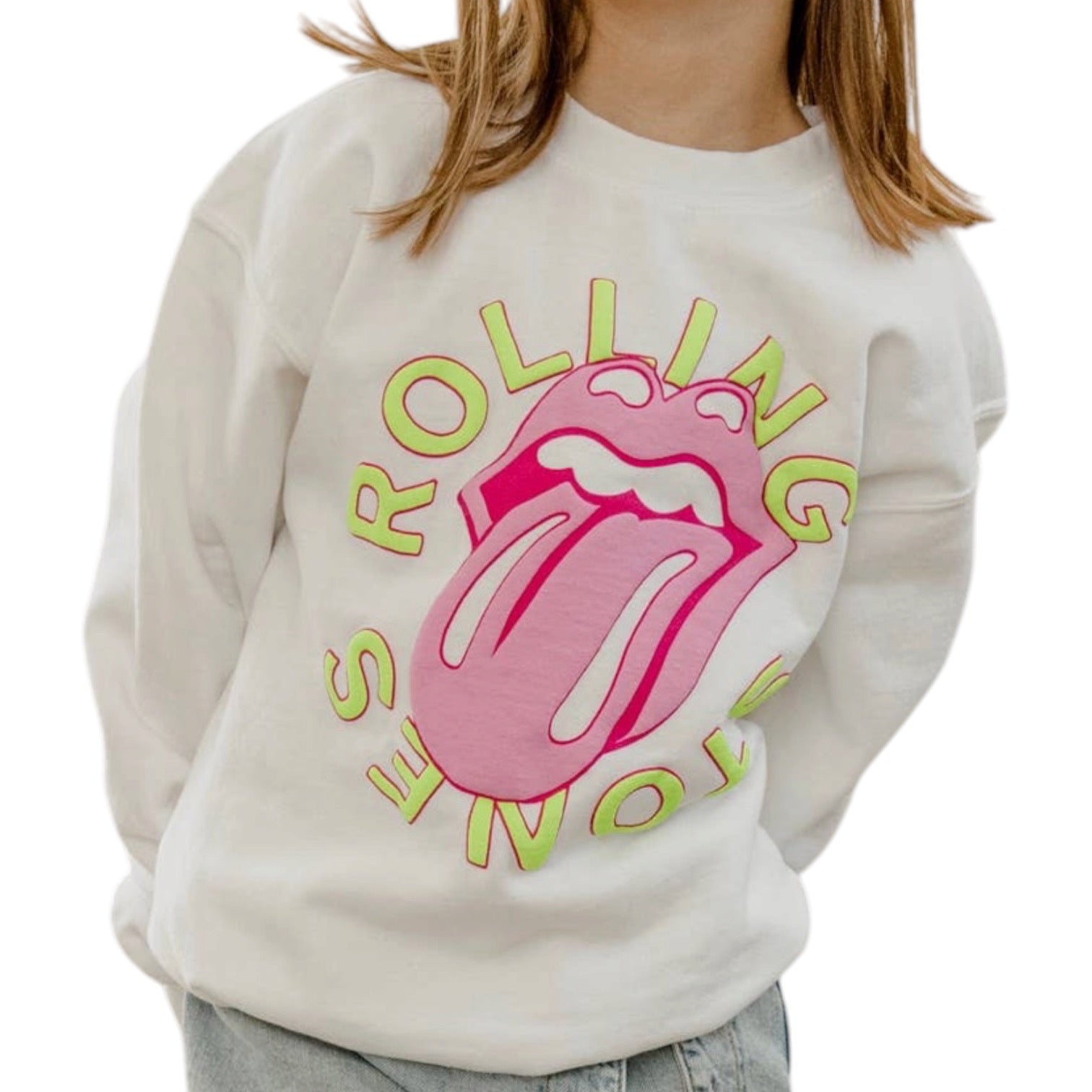 A child wearing a white crewneck sweatshirt featuring the iconic pink and lime green Rolling Stones tongue logo graphic on the front.
