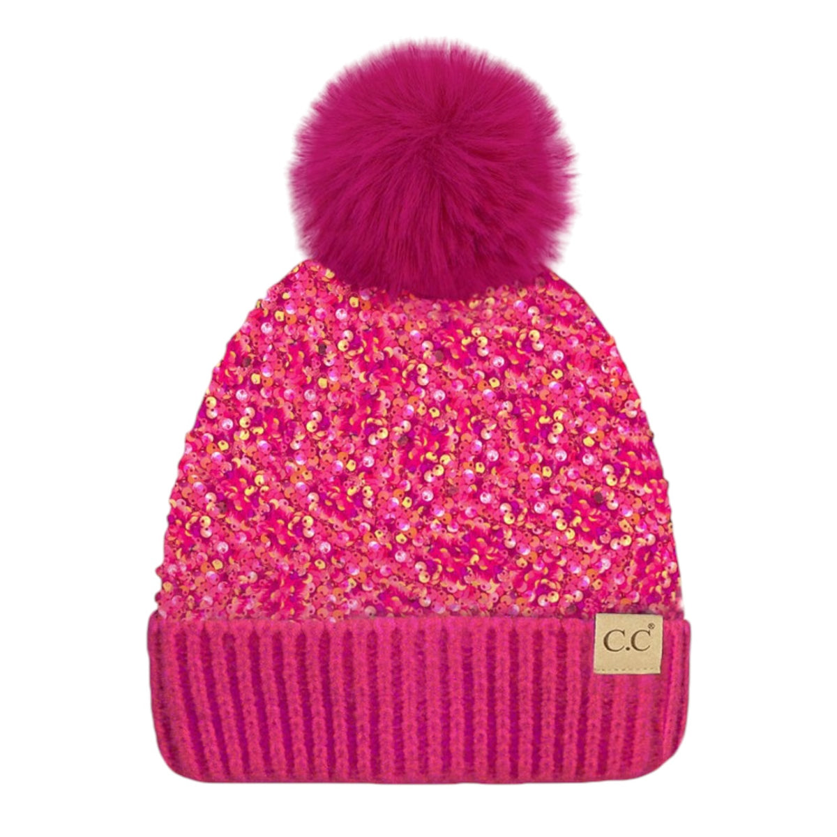 A hot pink knit beanie hat featuring a large fluffy pom-pom on top, covered in shimmering pink sequins, with a ribbed cuff and a small tan 'CC' logo patch on the side.
