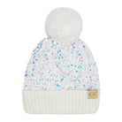A white knit beanie hat with a large white faux-fur pom-pom on top, covered in iridescent sequins that reflect blue, purple, and green hues. It features a ribbed cuff and a small tan leather patch with the letters 'CC' on the right side.